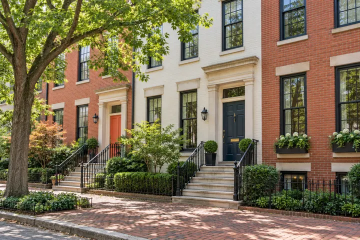 Brick rowhouse entrances and iron railings